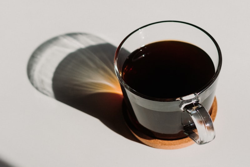 A flight of coffee cups set up for tasting on a table