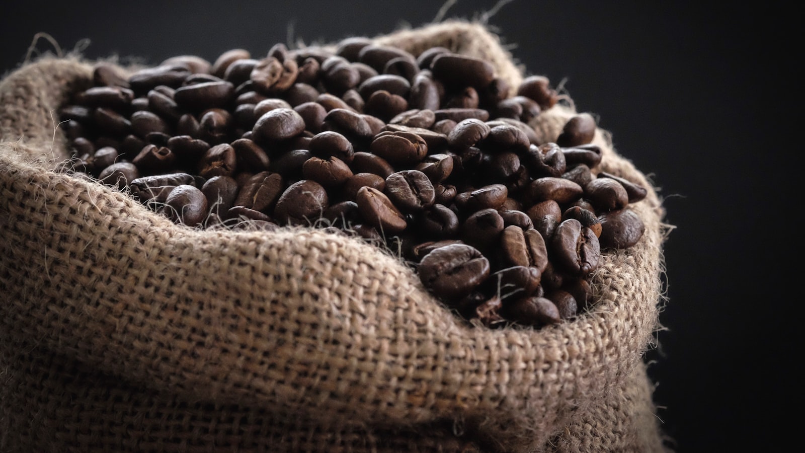 Several bags of specialty coffee beans on a shelf