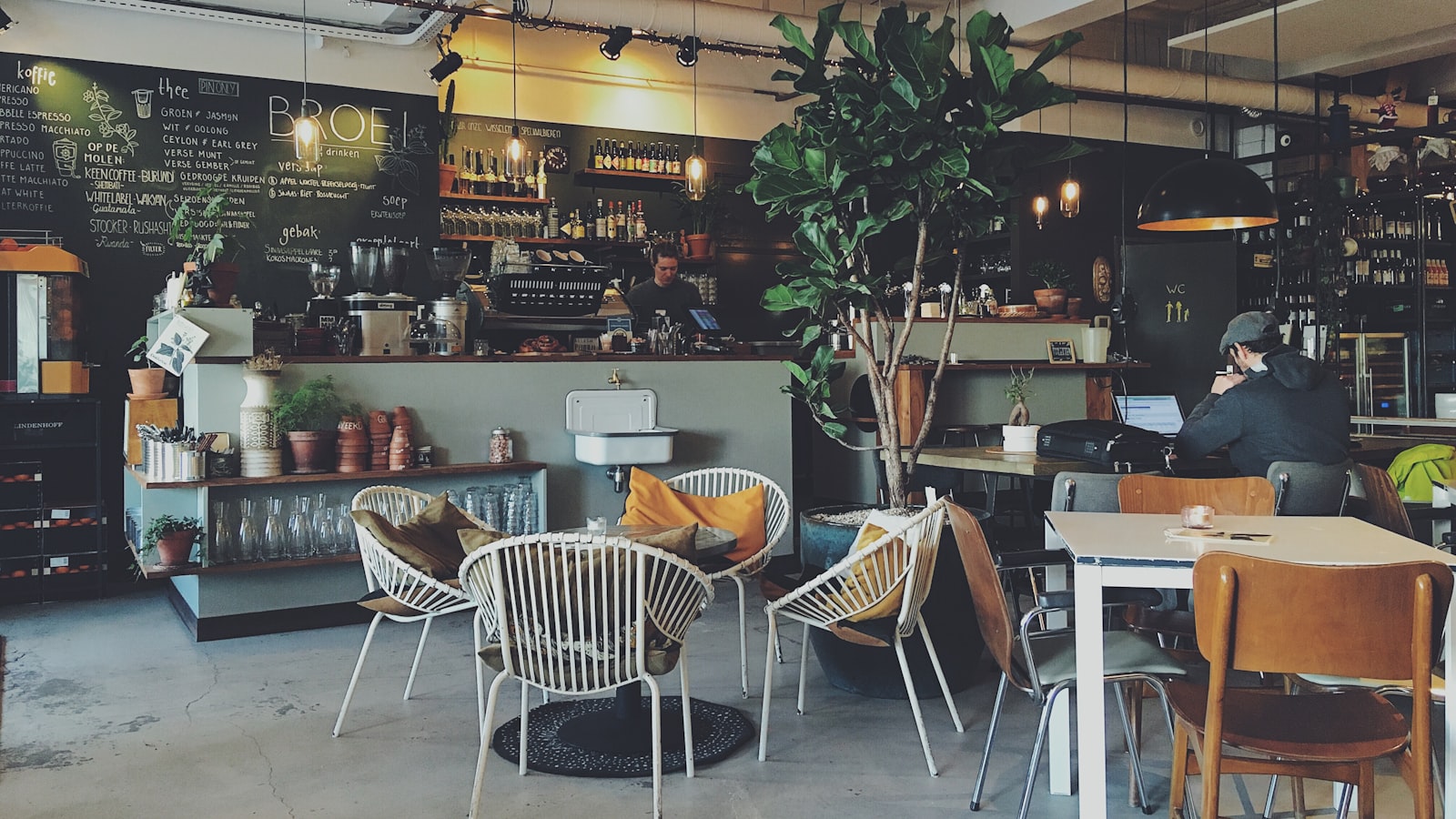 Interior of a busy traditional cafe with patrons at tables
